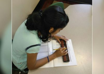 Child learning abacus at Genius Abacus Kids Academy.