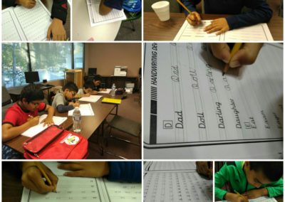 Students actively engaged in classroom learning and writing exercises.